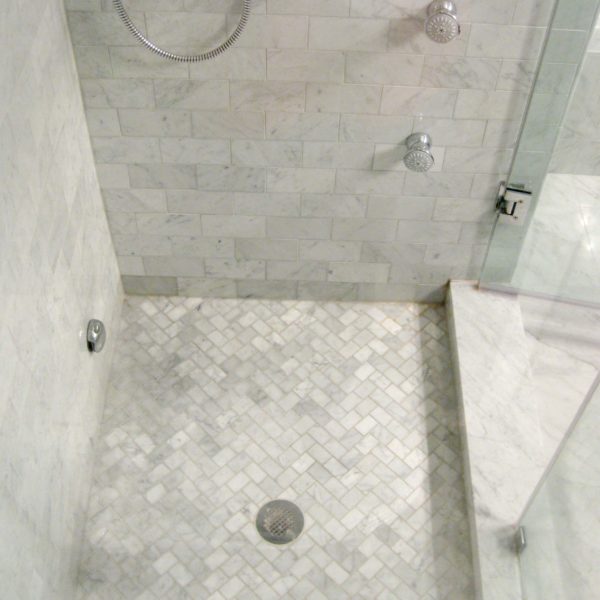 white marble shower with grohe